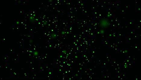 partículas verdes sobre un fondo negro