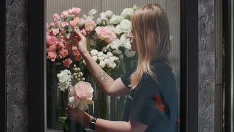 florist arranging flowers in a shop