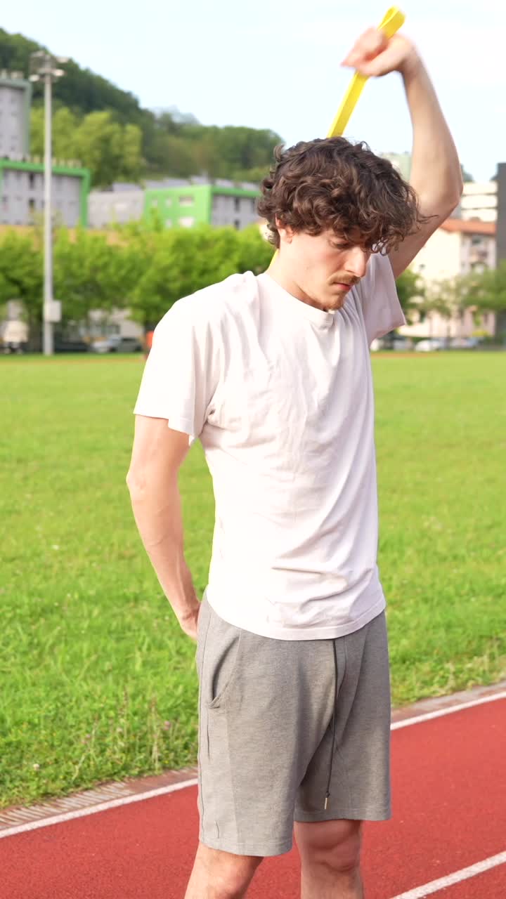 Man Stretching on Track