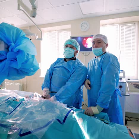 group of surgeons in operating room