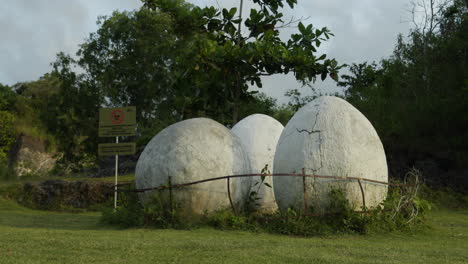 dolly backwards shot of the giant eggs in the cultural park bali garuda wisnu kencana on bali in indonesia