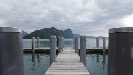 jetty pier boat dock on lake lucerne, cinematic aerial fpv flight