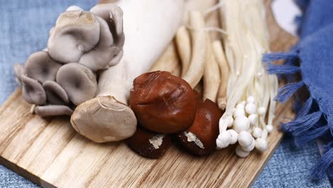 mixed mushroom on chopping board ,