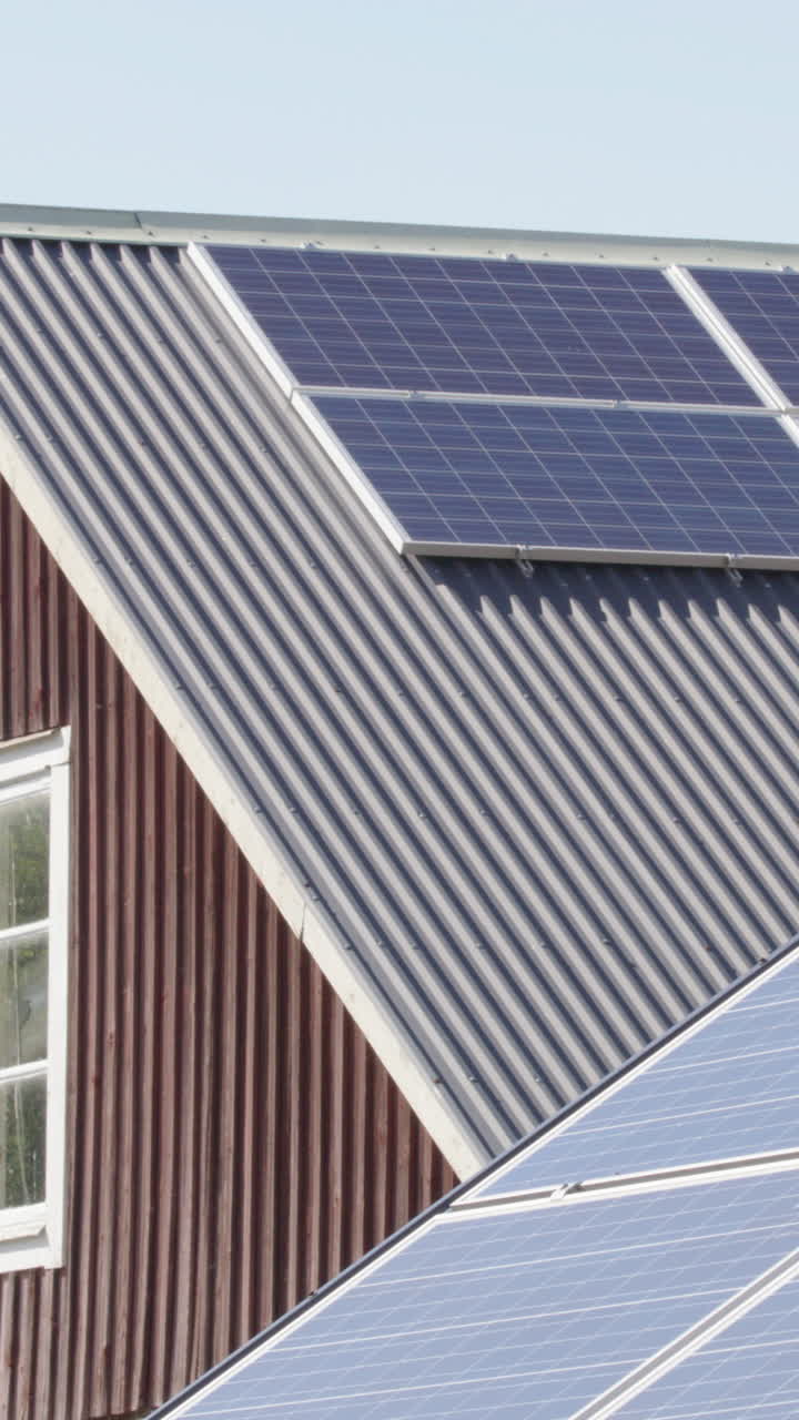 Solar panels mounted on roof of building, renewable energy. Vertical slider