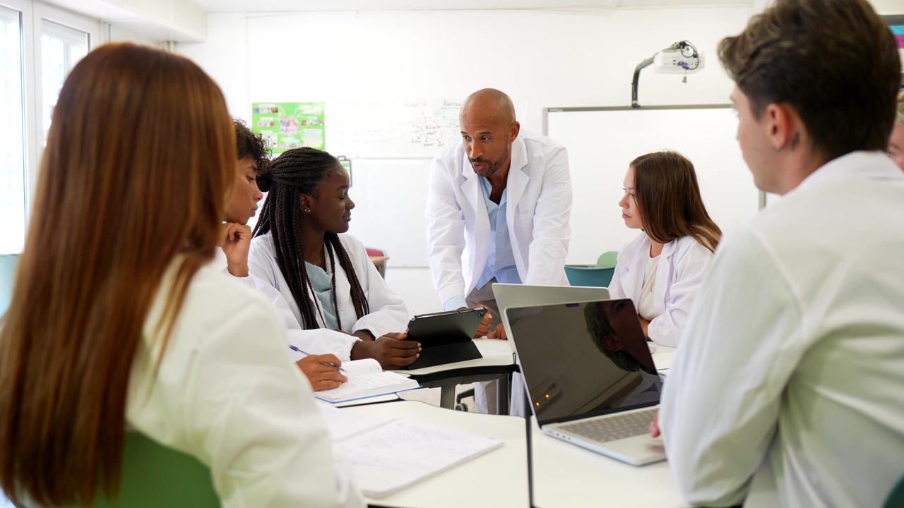 Medical Students and Instructor Discussing Case Study in Classroom