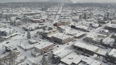 winter in downtown bend, oregon rising to reveal pilot butte | 4k