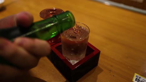 sequential pouring of a beverage into a glass