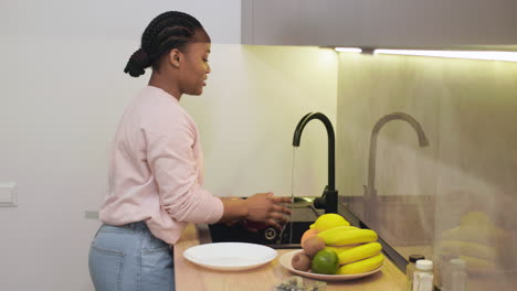 woman cleaning fruits