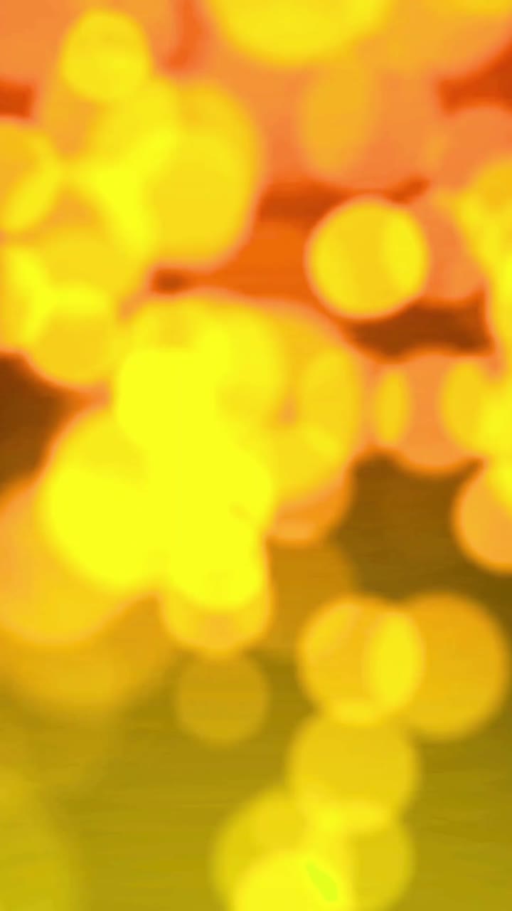 Blurred Yellow and Orange Glowing Bokeh Lights Background