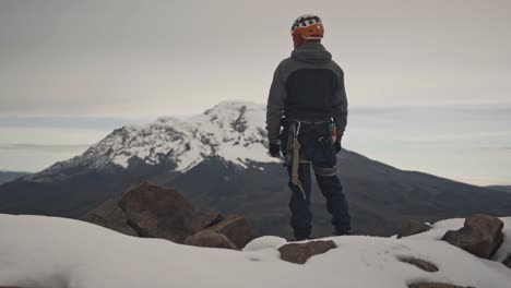 mountaineer on a snowy mountain peak