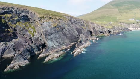 a drone shot of the rugged coastal terrain of the dingle peninsula, near dingle point, in ireland