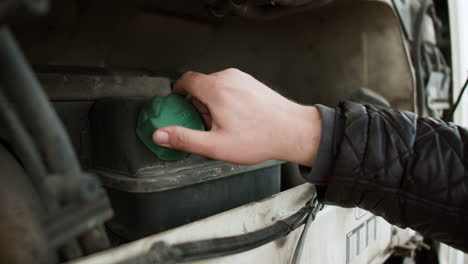 man opening oil deposit