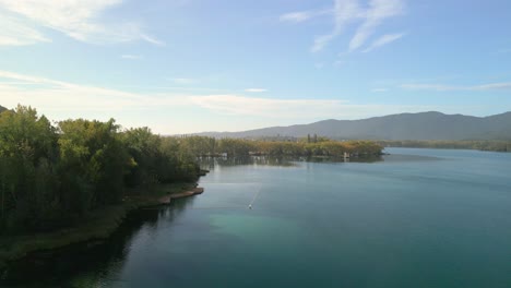 serene lake landscape with trees and mountains
