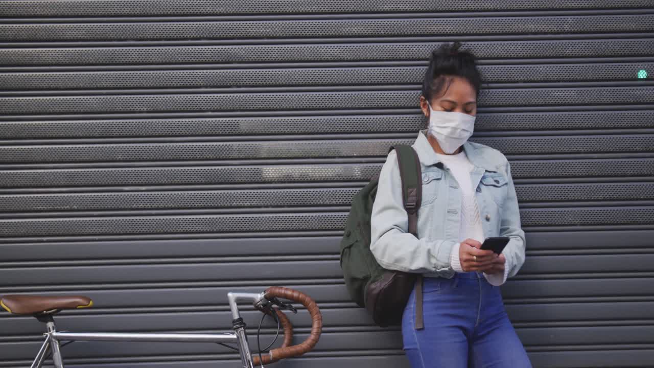 Woman wearing medical coronavirus mask on the street