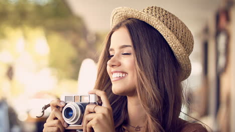 woman with straw hat and camera