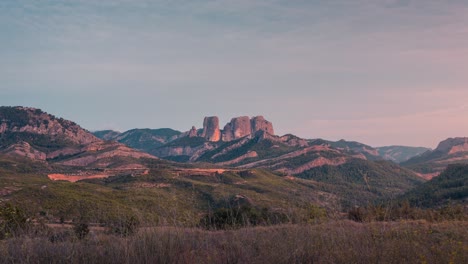 day to night view of roques de benet during sunset in parc national dels ports, san joan d´horta, catalunya, spain