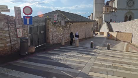 pilgrimage on the square of the basilica of saint francis of assisi in italy