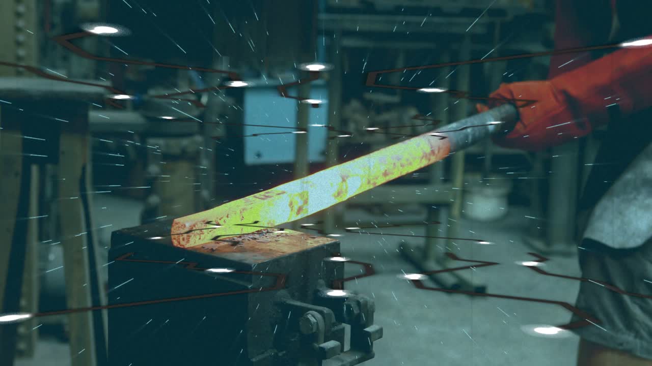 Male metalworker holding tongs, positioning glowing billet on anvil, hammer striking, sparks flying