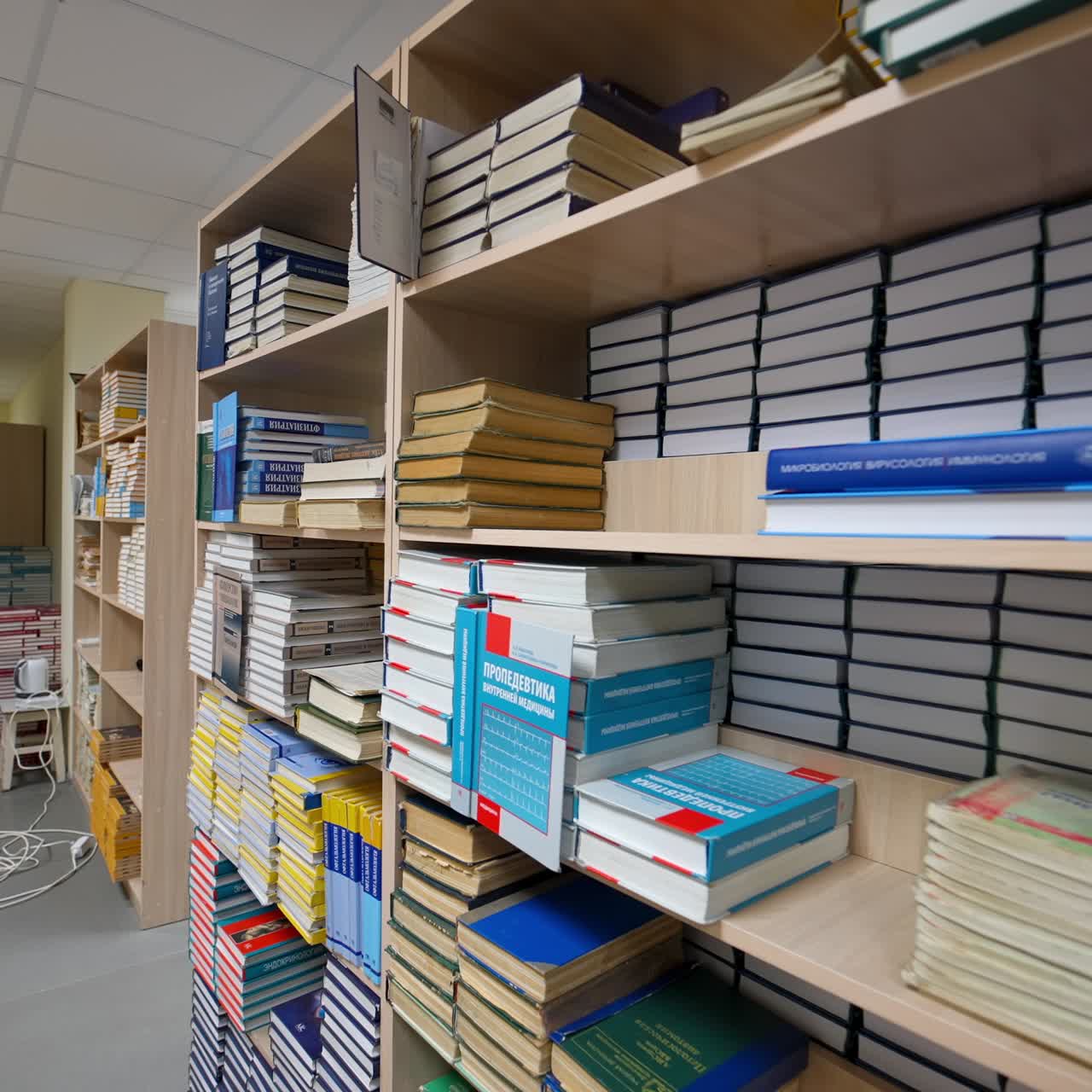 Books on wooden shelf in library