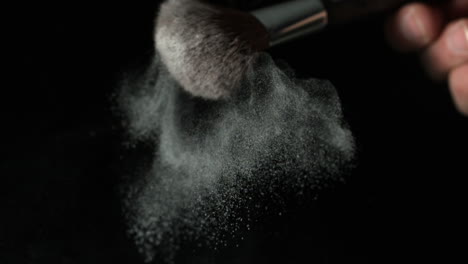 powder dispersing from make up brush