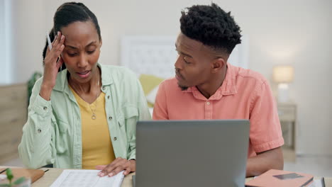 Couple,-laptop-and-stress-for-home-budget