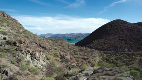 the arid desert vista leading towards bahia concepcion, baja california sur, mexico - aerial pullback shot