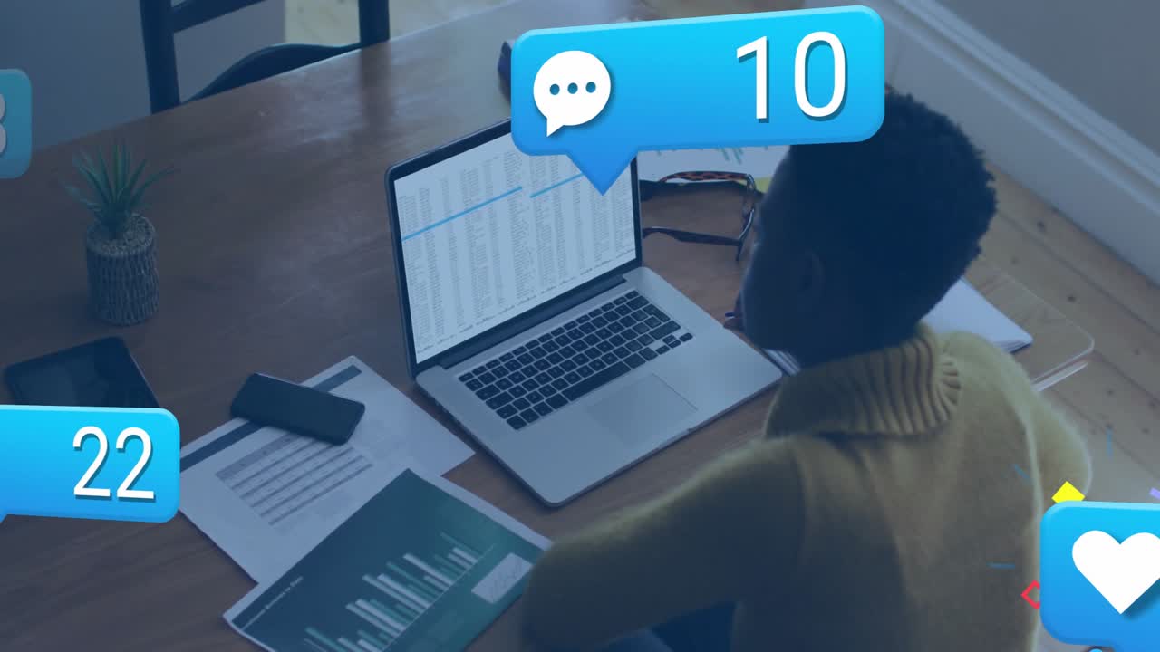 Woman reviewing data on office desk causing animated social media metrics climbing around laptop