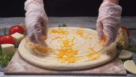 preparing a pizza with cheese