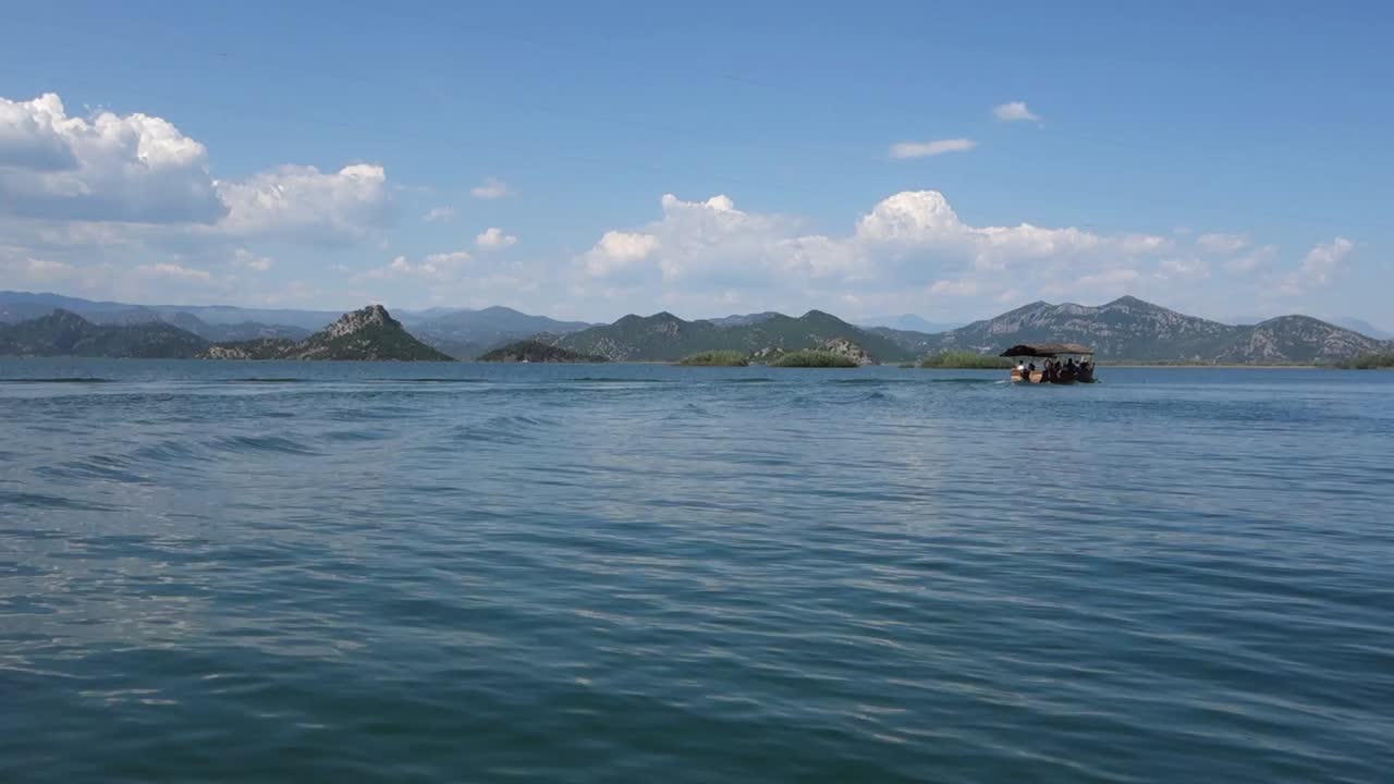 navigating on Lake Skadar, the largest lake in Southern Europe, on the border of Albania and Montenegro