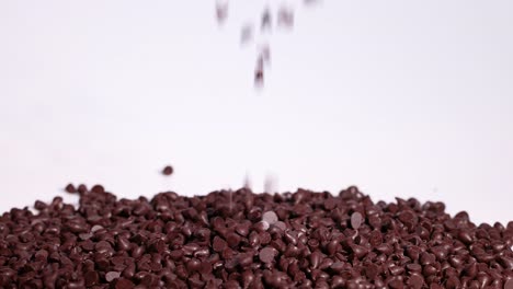 chocolate chips cascading onto a pile