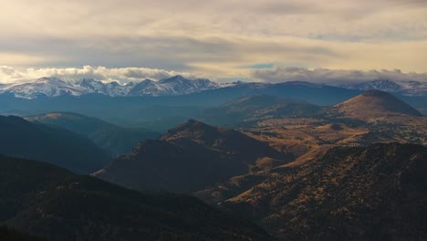 Sweeping-mountain-vista-of-forested-foothills-and-snowy-ridges-of-Lost-Gulch-Overlook-Boulder-Colorado-at-sunset