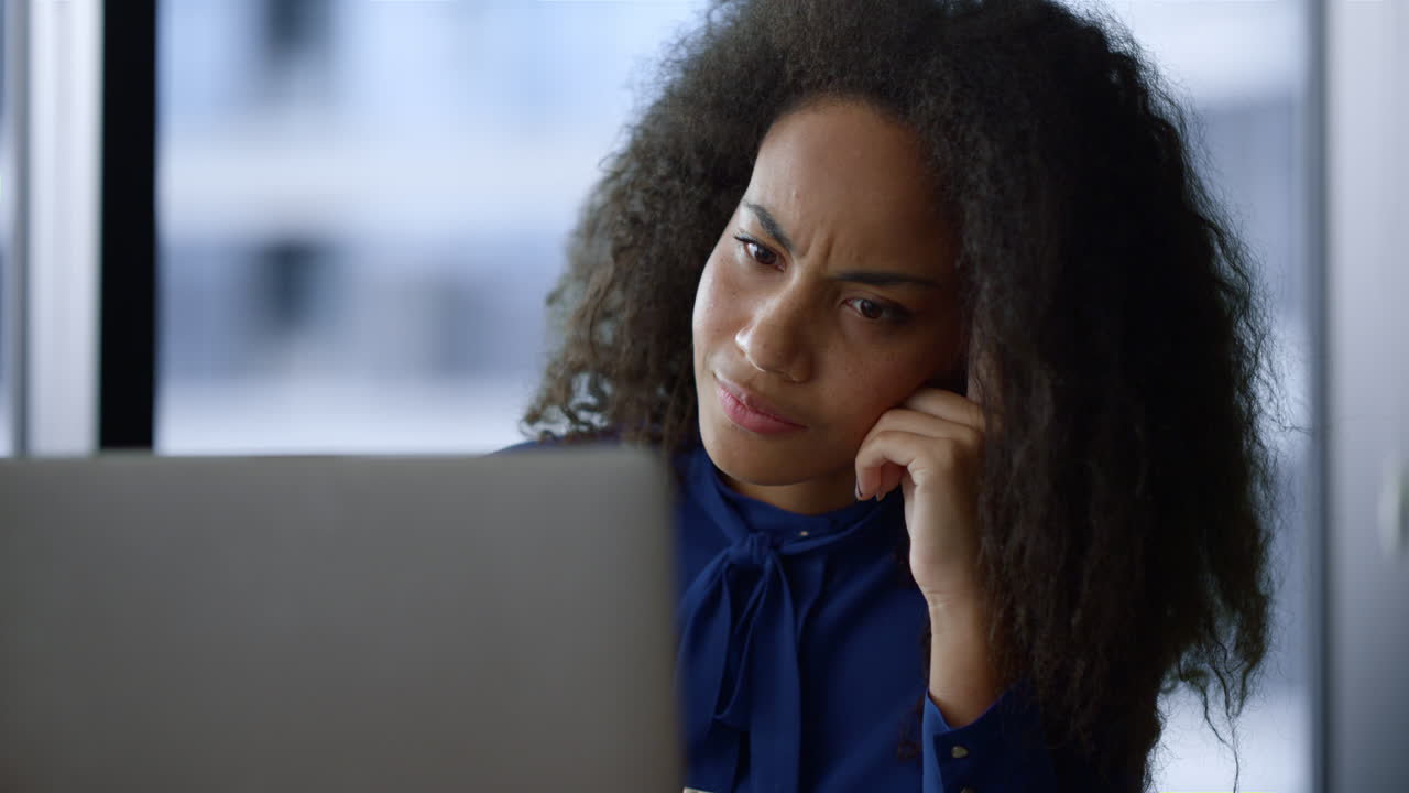 Thinking professional woman working computer solving problem in home office.