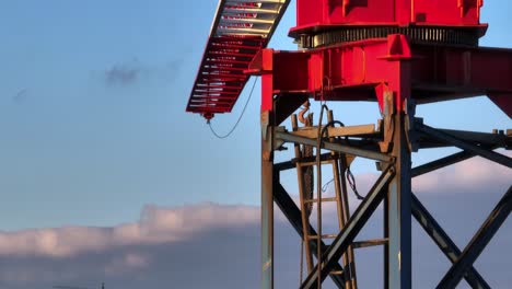 Ladder-inside-the-structure-of-a-crane,-close-up-aerial-view