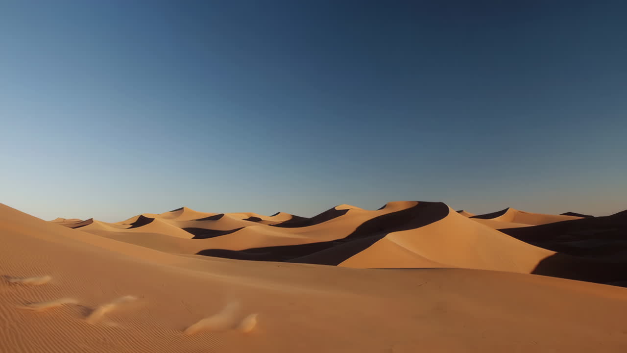 Golden Sand Dunes in a Vast Desert Landscape with Windblown Sand