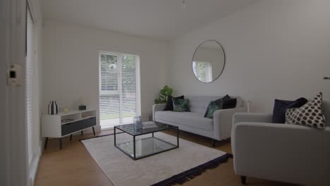 spacious and well-appointed living room in a show home