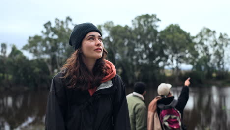 woman, hiking and friends at a lake in nature