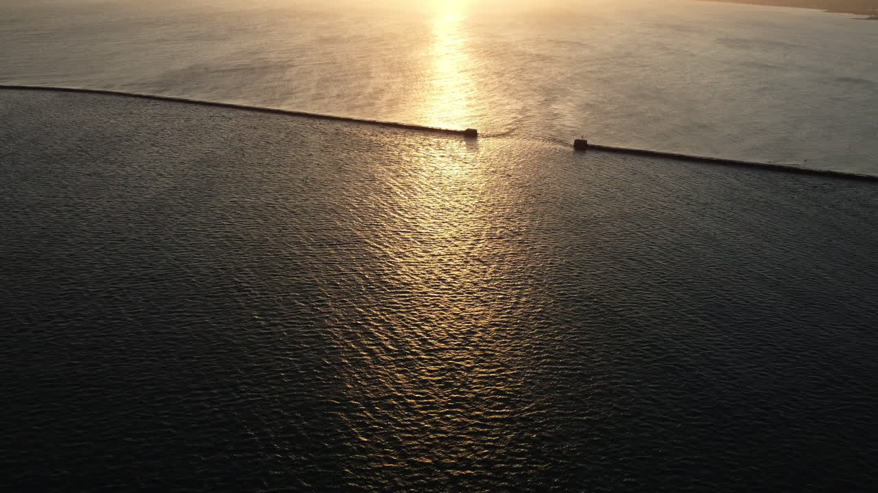 Sunset over a Breakwater