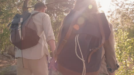 Happy Couple Hiking in Woods