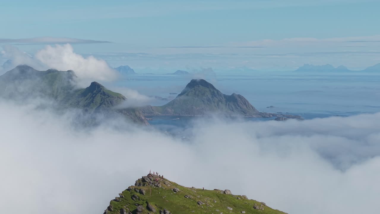 A Cloud-draped Summit With Island Views on Nonstinden, Near Ballstad, Lofoten, Norway - Orbit Drone Shot