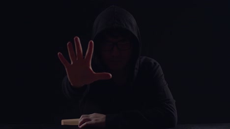 hacker showing stop hand