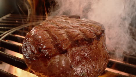 grilled steak cooking on a barbecue grill