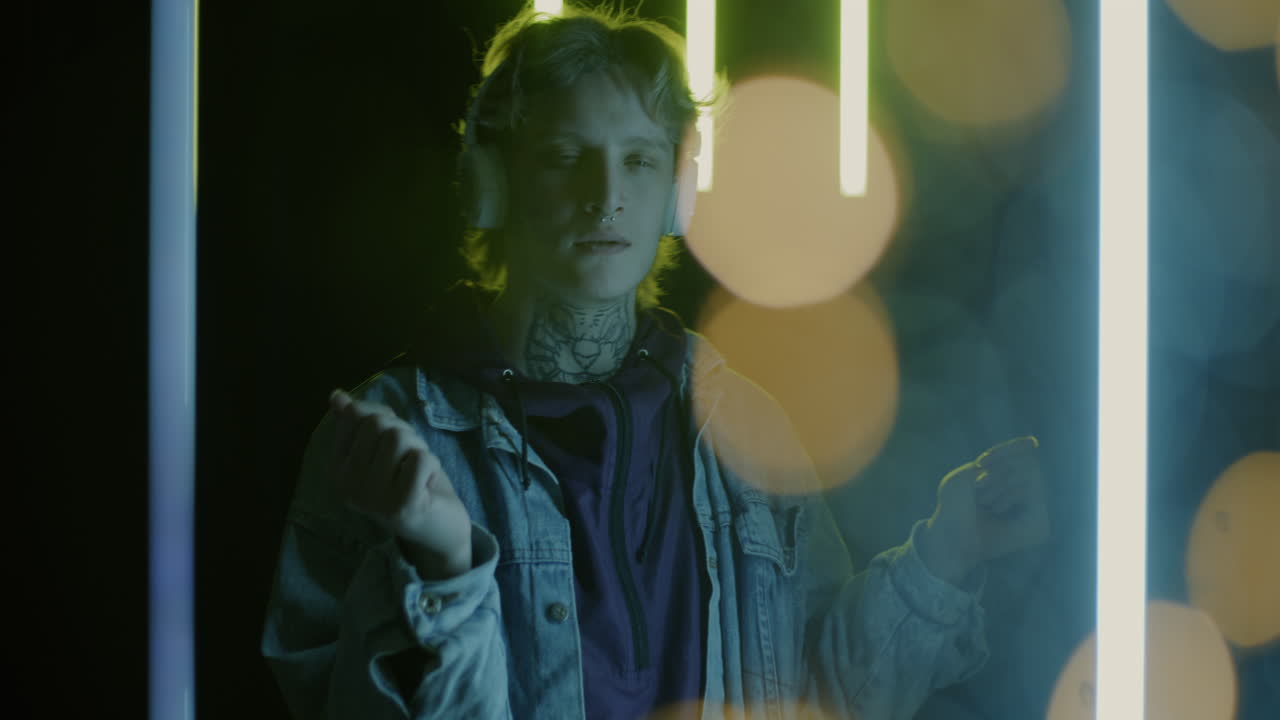 Young Person Dancing to Music in Neon Lights