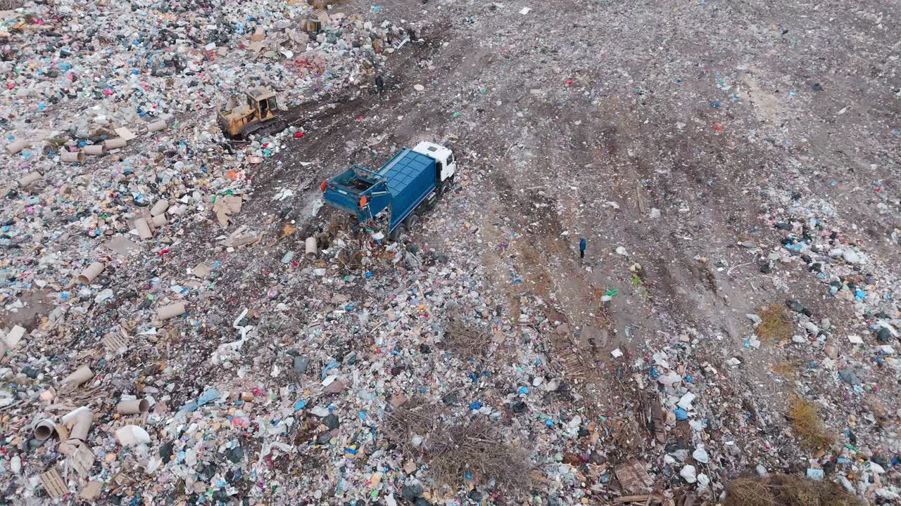 Aerial View of Landfill with Garbage Truck and Workers