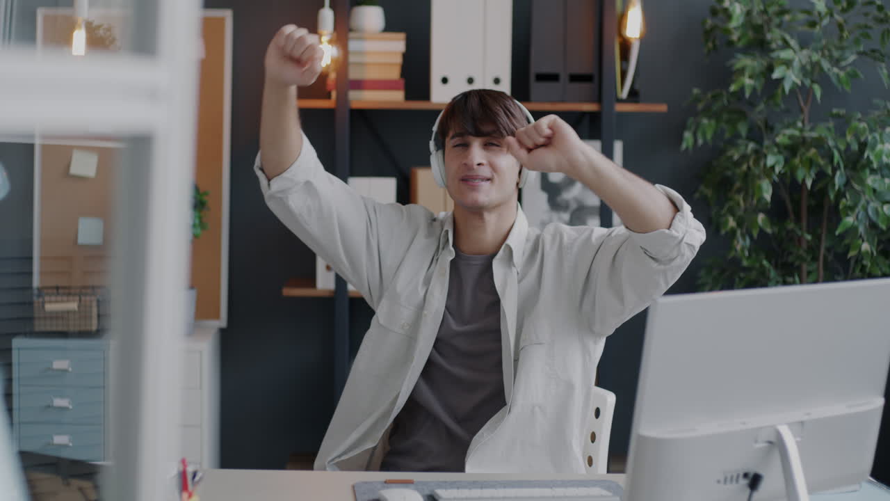 Man enjoying music while working from home