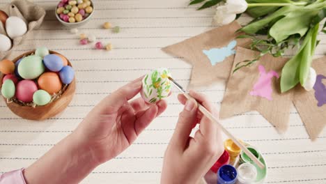 happy easter holiday. coloring eggs top view. woman preparing for easter, painting and decorating eggs. christian celebration, family traditions.