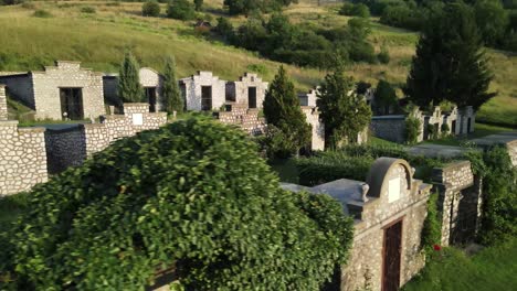 aerial view looking down on small mausoleums in varbo, hungary cemetery