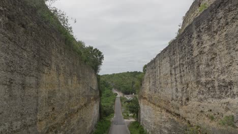 Old-road-connecting-La-Romana-to-Higuey-with-bridge-crossing-Rio-Chavon-river,-Dominican-Republic