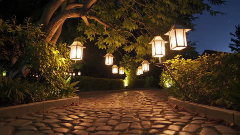 night garden pathway with hanging lanterns