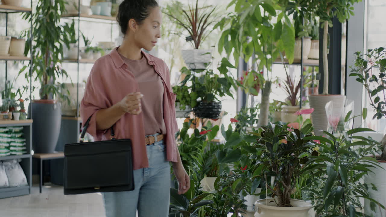 Woman Shopping for Plants in a Garden Center