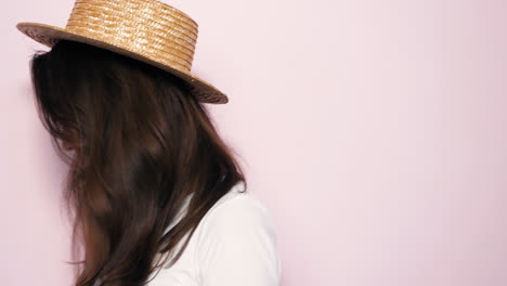 woman wearing straw hat